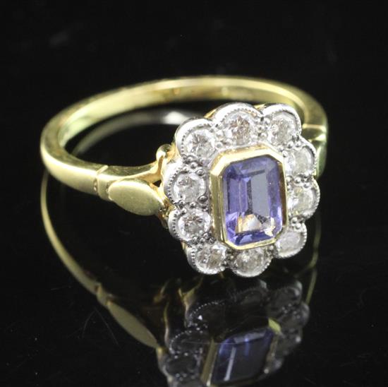 A modern 18ct gold, tanzanite and diamond cluster ring, size O.